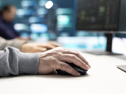 Cyber security experts in governmental hacking room working on securing networks